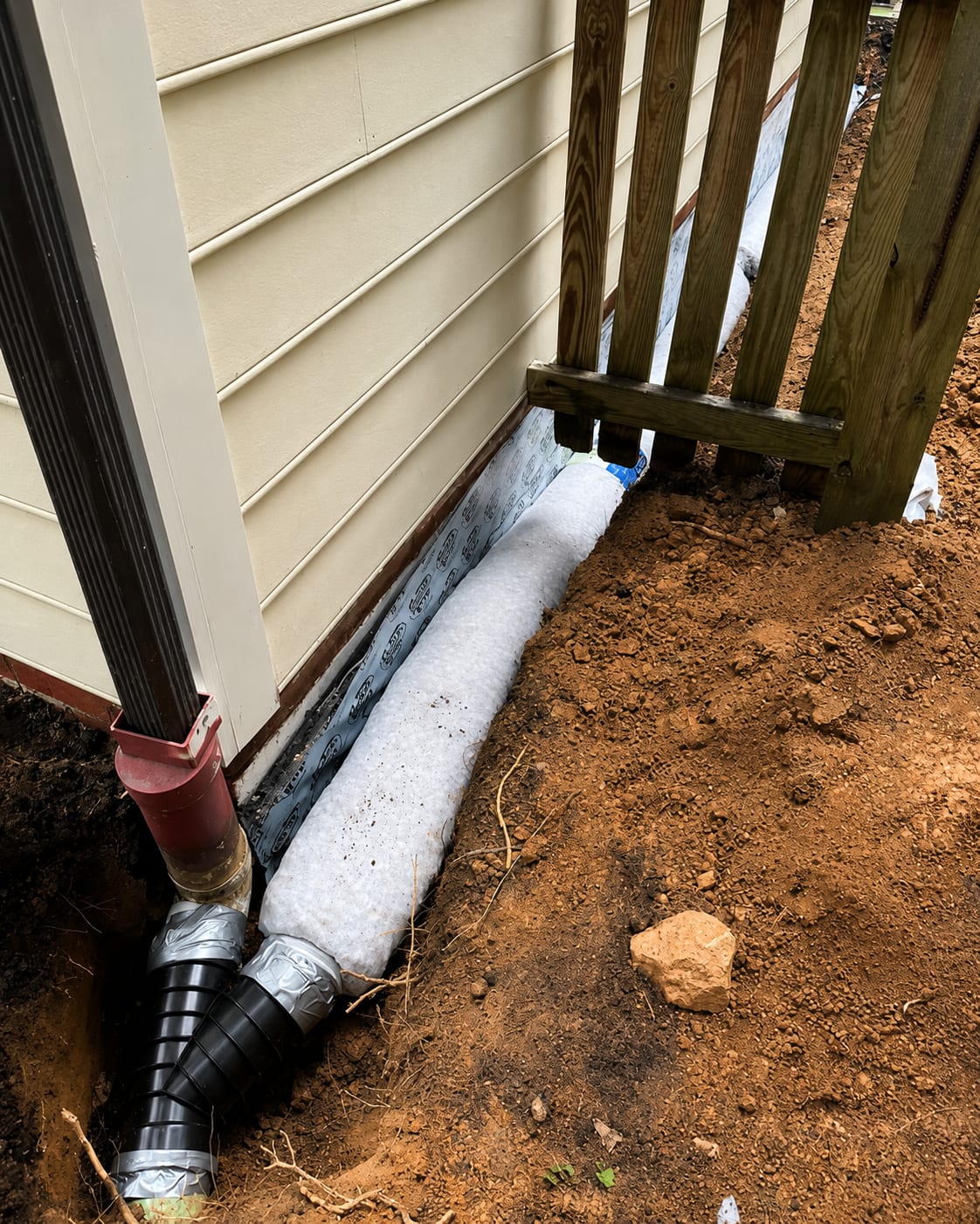 A drain pipe connected at a downspout in the open trench, Bethesda, MD