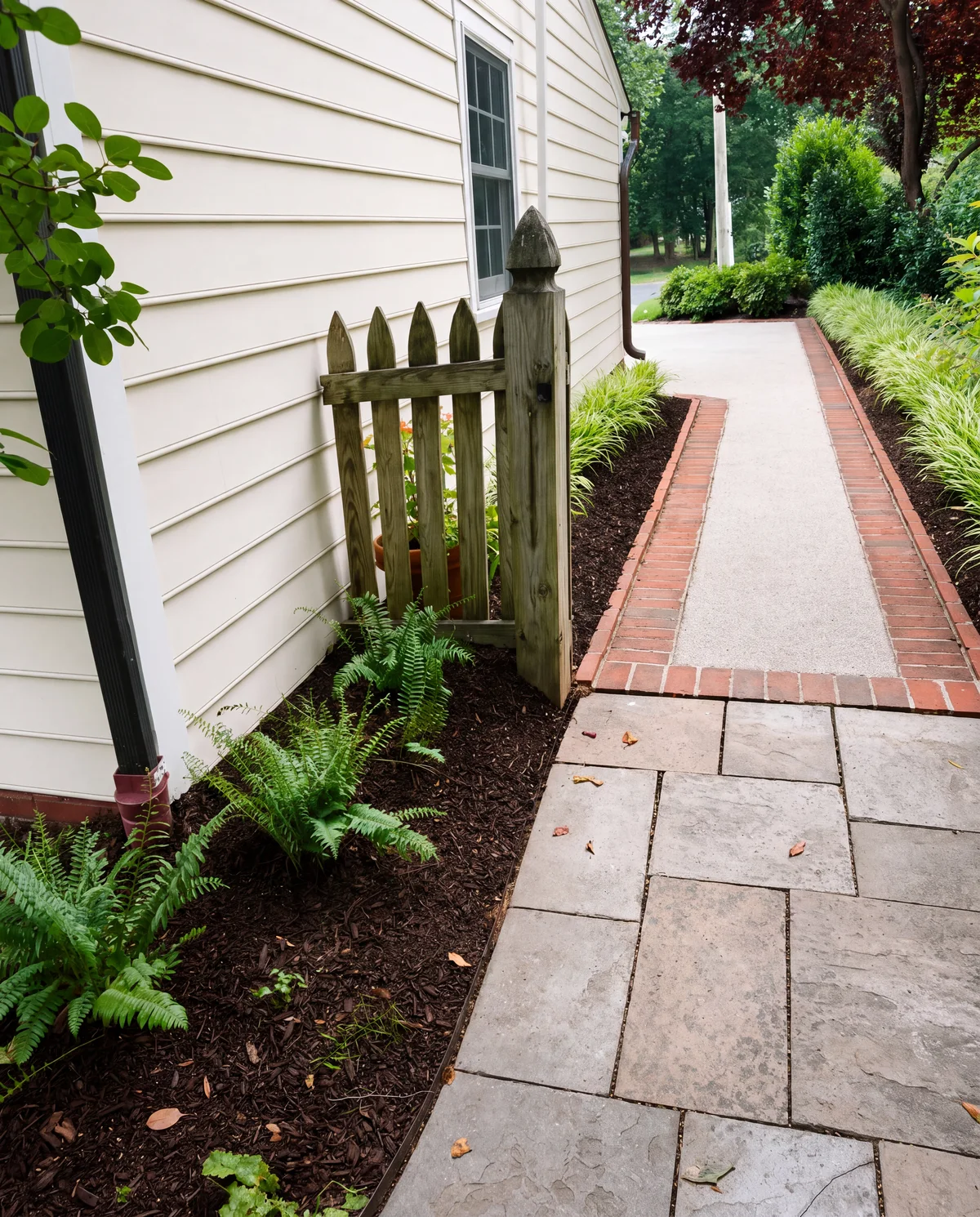 The side yard walkway restored with brick edging and stone, Bethesda, MD